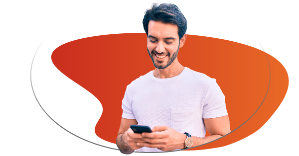 Smiling man with mobile phone in hands